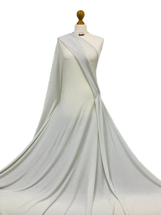 Compra argento-su-bianco Tessuto elasticizzato in jersey a pois lurex