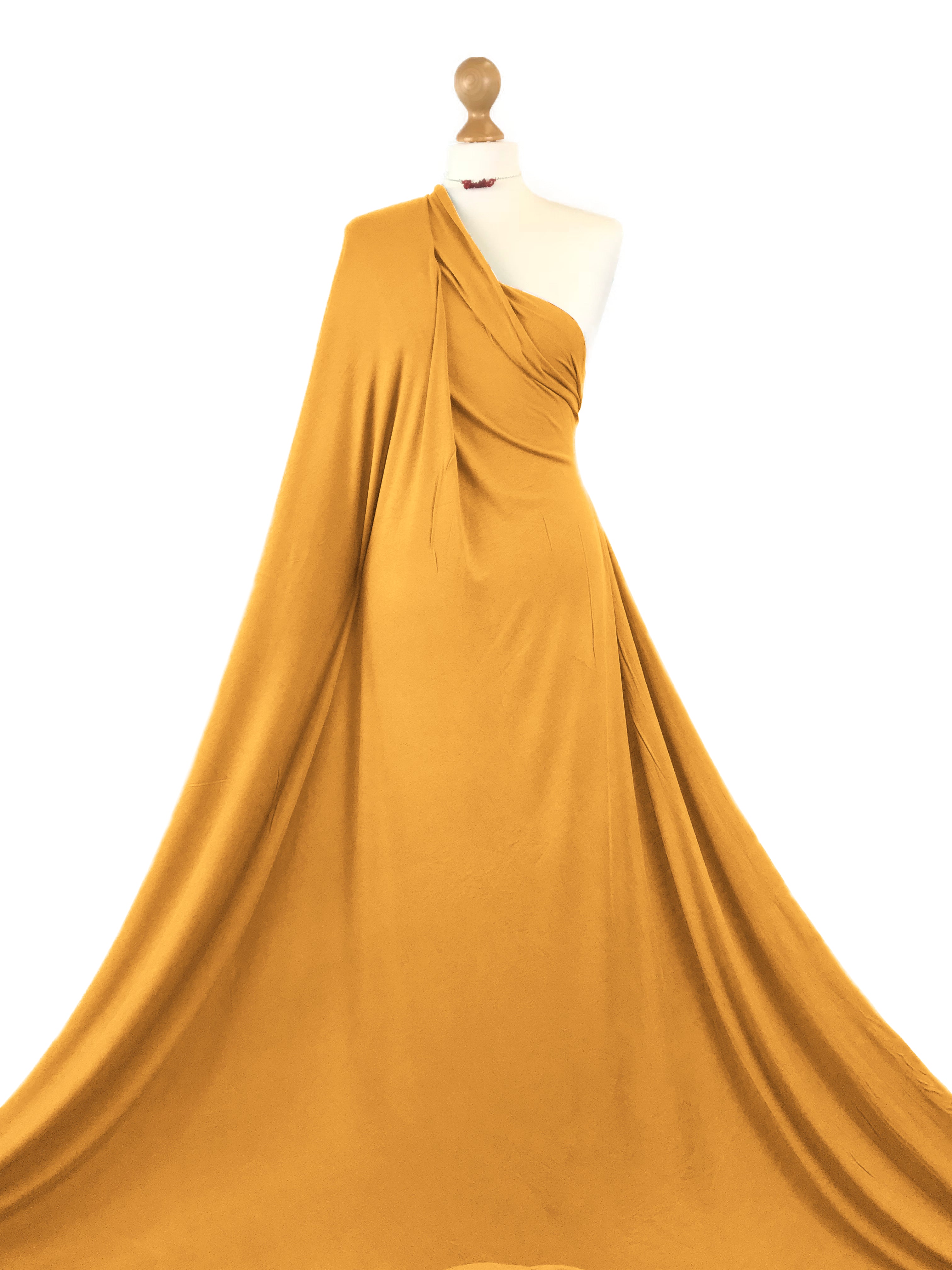 Buy mustard Viscose Jersey 4 Way Stretch Fabric